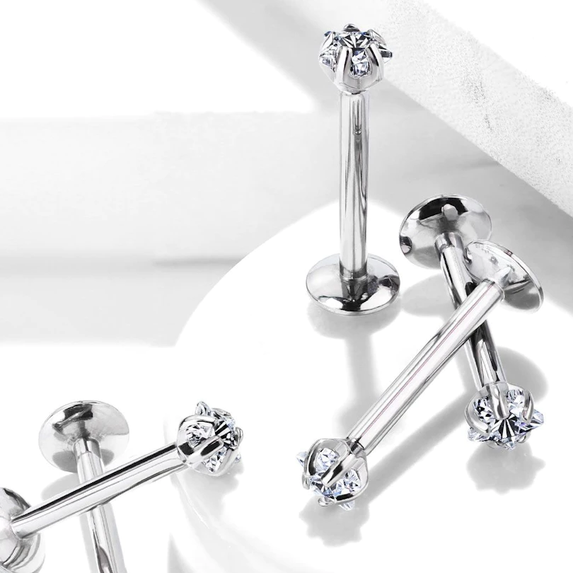 Labret de titanio con diferentes modelos de piedra.