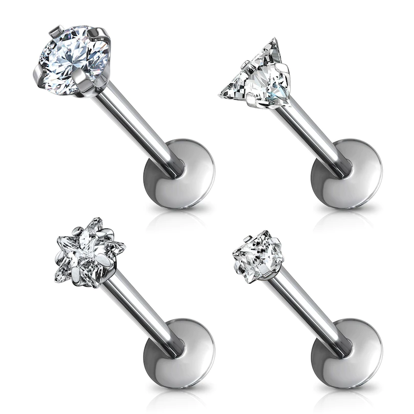 Labret de titanio con diferentes modelos de piedra.