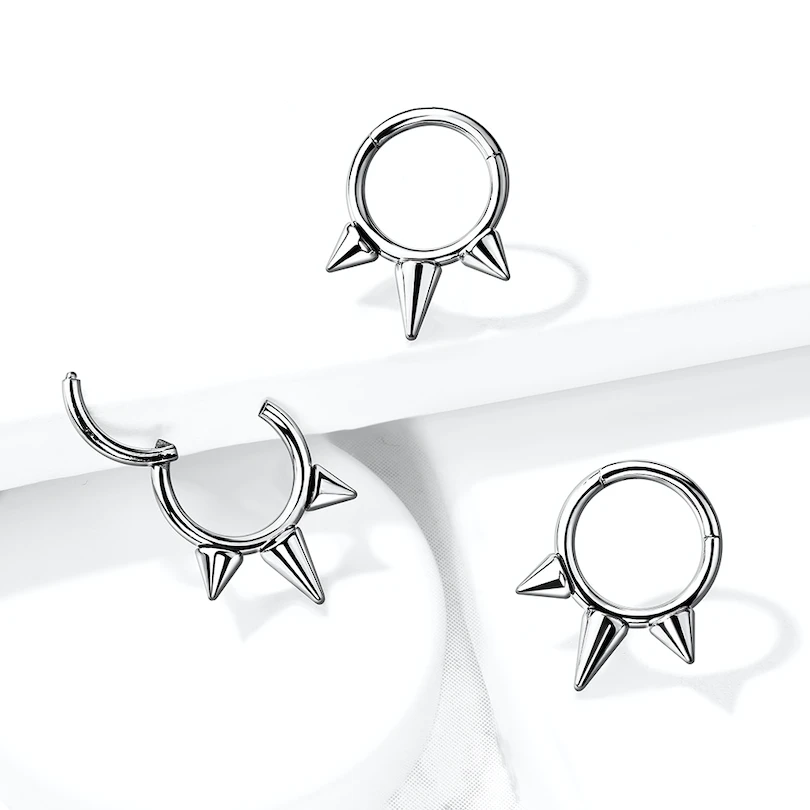 Hinged titanium ring with spikes